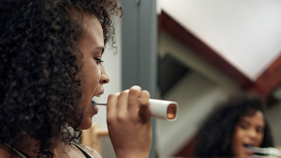 Woman tooth brushing